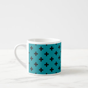 Black polka crosses on teal espresso cup
