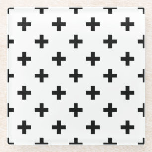 Black polka crosses on white glass coaster