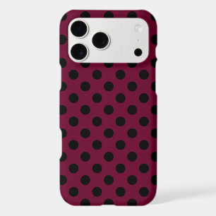 Black polka dots on burgundy