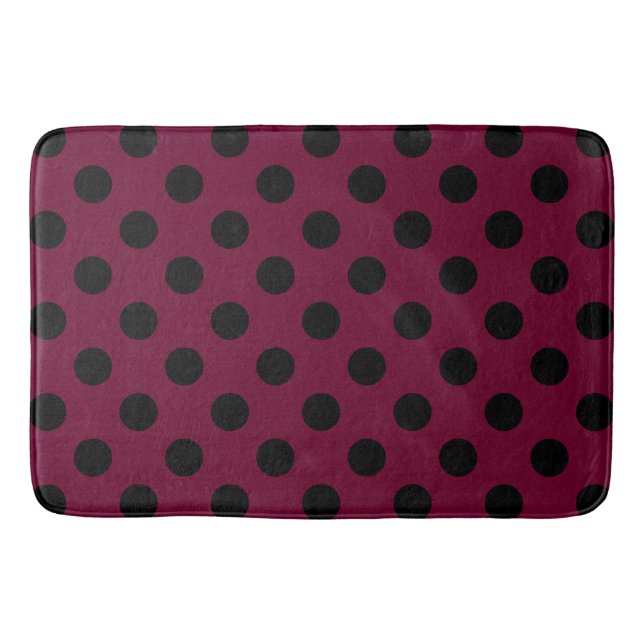 Black polka dots on burgundy bath mat (Front)