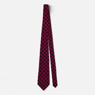 Black polka dots on burgundy tie