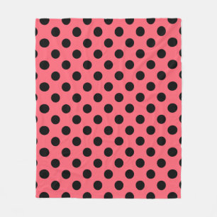 Black polka dots on coral fleece blanket
