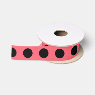 Black polka dots on coral satin ribbon