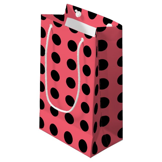 Black polka dots on coral small gift bag (Front Angled)