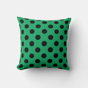 Black polka dots on fresh green cushion