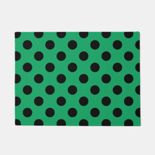 Black polka dots on fresh green doormat