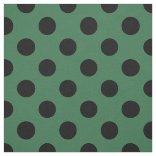 Black polka dots on kelly green fabric