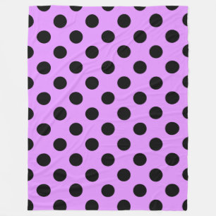 Black polka dots on lilac fleece blanket