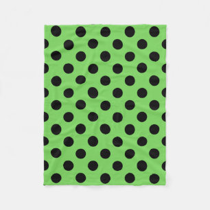 Black polka dots on lime green fleece blanket