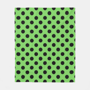 Black polka dots on lime green fleece blanket