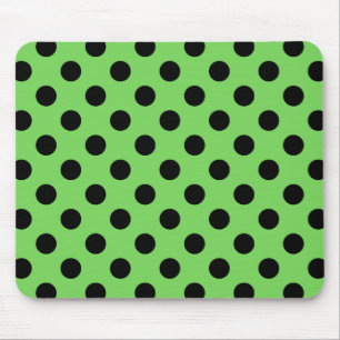 Black polka dots on lime green mouse mat