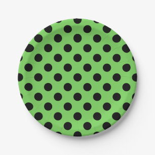 Black polka dots on lime green paper plate