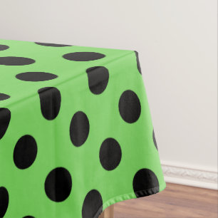 Black polka dots on lime green tablecloth