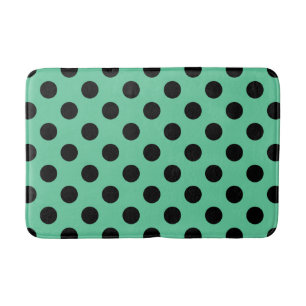 Black polka dots on mint green bath mat