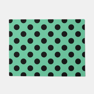 Black polka dots on mint green doormat