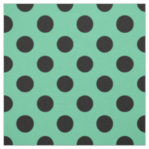 Black polka dots on mint green fabric