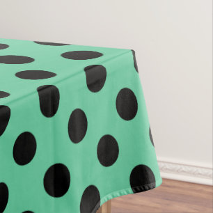 Black polka dots on mint green tablecloth