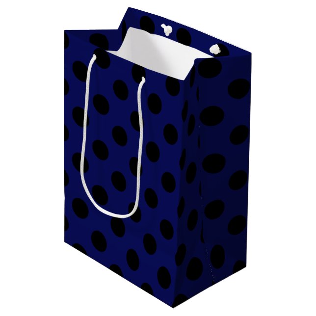Black polka dots on navy blue medium gift bag (Front Angled)