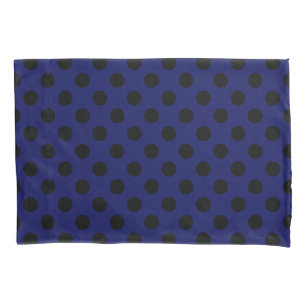 Black polka dots on navy blue pillowcase