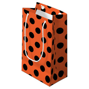 Black polka dots on orange small gift bag