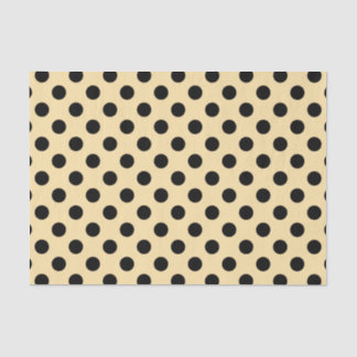 Black polka dots on pale yellow tissue paper