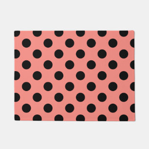 Black polka dots on peach doormat