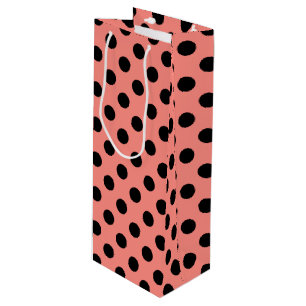 Black polka dots on peach wine gift bag