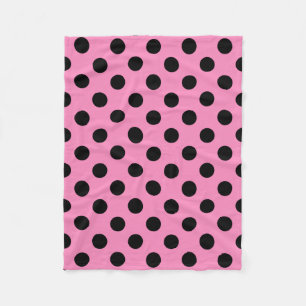 Black polka dots on pink fleece blanket