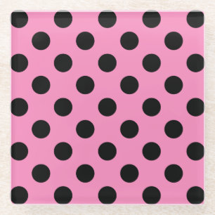 Black polka dots on pink glass coaster