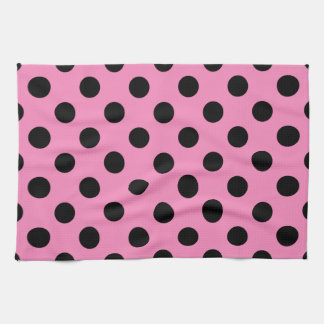Black polka dots on pink tea towel