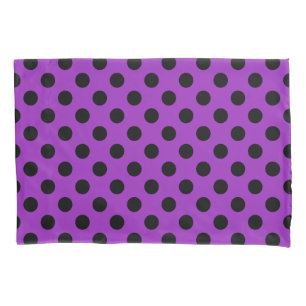 Black polka dots on purple pillowcase