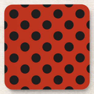 Black polka dots on red coaster