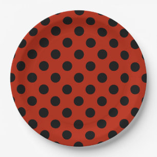 Black polka dots on red paper plate