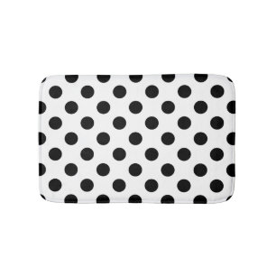 Black polka dots on white bath mat