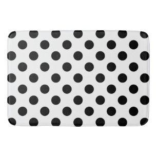 Black polka dots on white bath mat