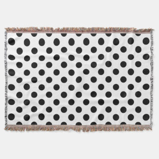 Black polka dots on white throw blanket