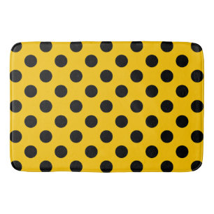 Black polka dots on yellow bath mat