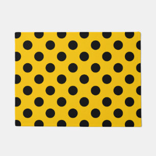 Black polka dots on yellow doormat