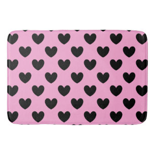 Black polka hearts on cotton candy pink bath mat