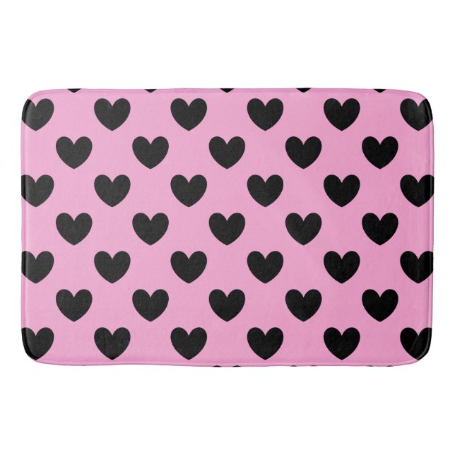 Black polka hearts on cotton candy pink bath mat (Front)
