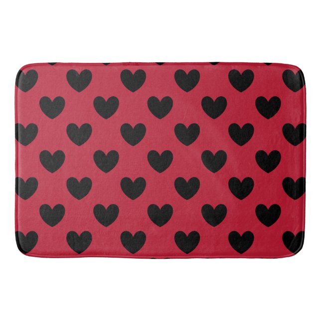 Black polka hearts on red bath mat (Front)