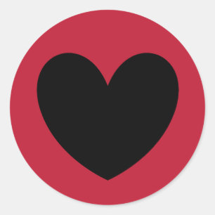 Black polka hearts on red classic round sticker