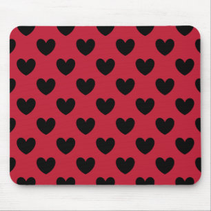 Black polka hearts on red mouse mat