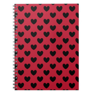 Black polka hearts on red notebook