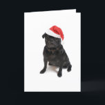 Black pug dog with red santa hat holiday card<br><div class="desc">Cute little black pug sitting with a red santa claus or christmas hat</div>