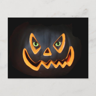 Black pumpkin with cat eyes postcard