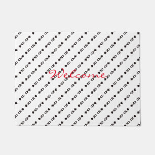 Black queen of spades mirrored pattern on white doormat