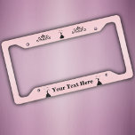 Black Silhouette Lady Ruffled Dress Doves Pink Licence Plate Frame<br><div class="desc">This license plate frame is light pink with a black silhouette of a lady in a long ruffled dress holding a letter with fancy doves flying over her head along with two ornate black scroll designs.  Customise your text at the bottom with the template.</div>