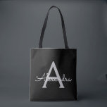 Black Silver Modern Script Girly Monogram Name Tote Bag<br><div class="desc">Black and Silver Elegant Add Your Own Name Monogram Book Bag. This Book Bag can be customised to include your initial and first name and given as a gift for Christmas,  Sweet 16 Birthday,  Bridal Shower or a Wedding.</div>
