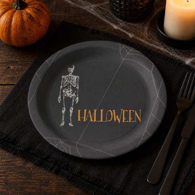 Black Skeleton Spiderweb Halloween Party Paper Plate (Set the table for a frightfully fun celebration with these dramatic skeleton Halloween paper plates.)